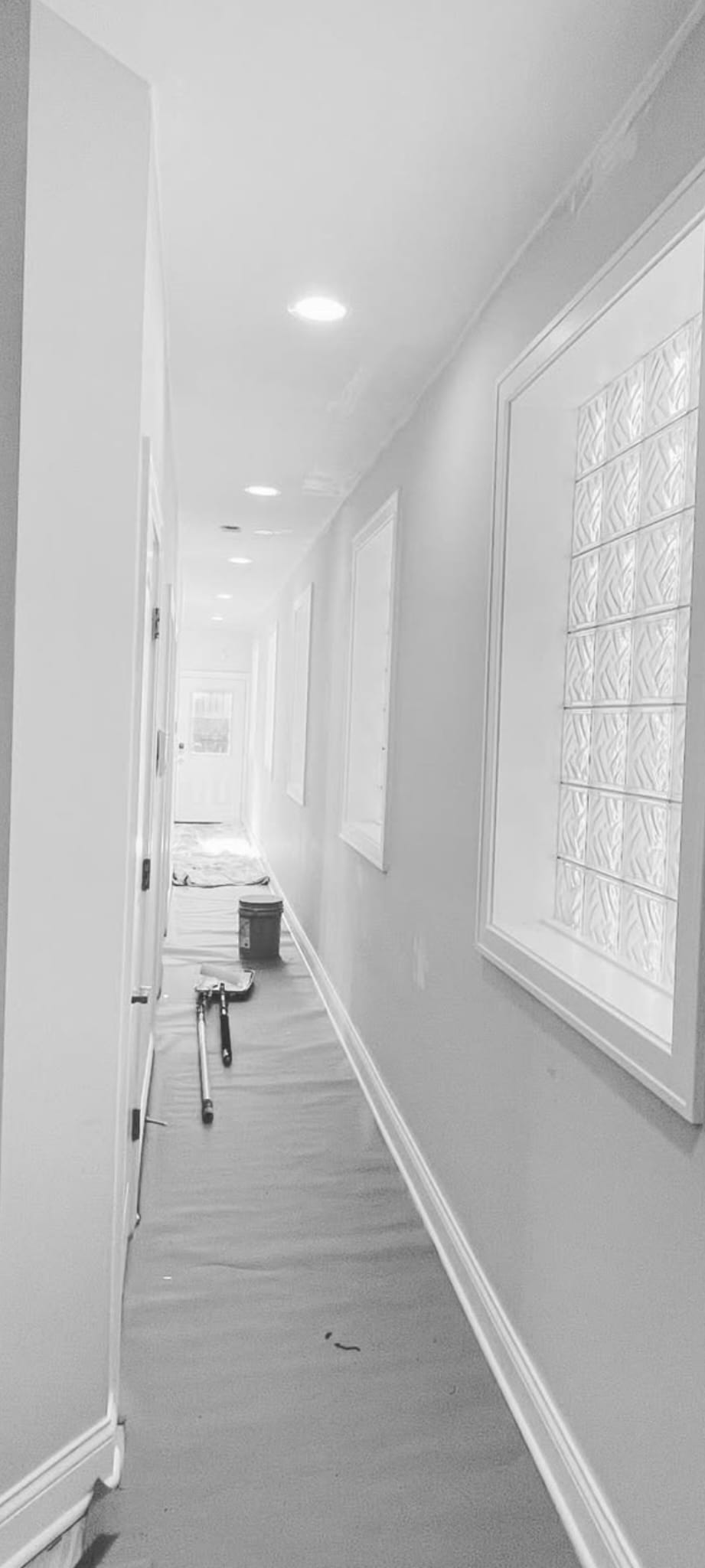 Hallway during refurbishment — replastered and redecorated